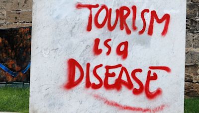 'It's Tourist Hunting Season': The Street Art That's Seething About Mass Tourism