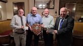 Rotary Club of Oldham present Community Service Shield to Latics saviour Frank