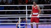 Boxer at the centre of gender controversy wins Olympic fight in just 46 seconds