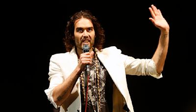 Russell Brand says Bear Grylls 'flanked' him as he was baptised in Thames