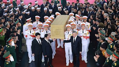 Thousands of mourners gather for the funeral of Communist Party general secretary Trong