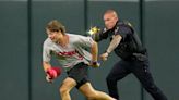 Reds fan runs on field, does backflip before getting Tased