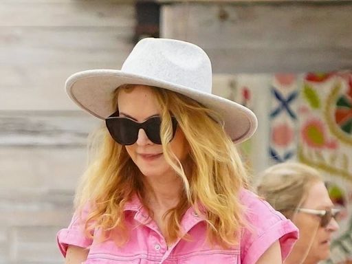 Heather Graham, 54, shows off her toned legs in hot pink co-ord