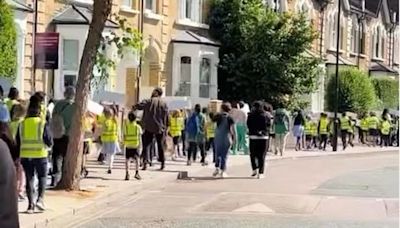 Hackney primary school students chant in streets urging people to vote