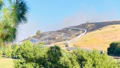 Firefighters battle brush fire in San Jose