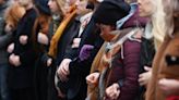 Mourners march, hold mass hug to remember Prague shooting victims