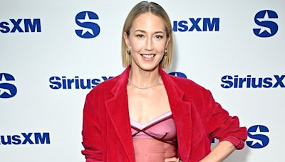 Carrie Coon bares belly in sheer tank top beneath red pantsuit in NYC