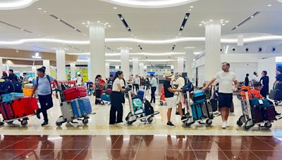 Dubai airport struggles to resume flights after heavy rains leave runways underwater