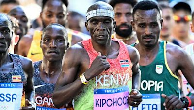 World's greatest marathon runner takes a TAXI to finish line