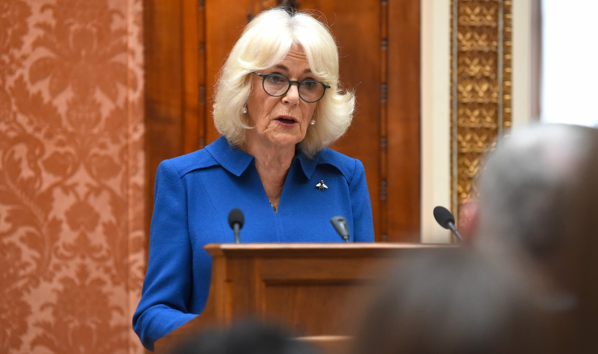 Queen Camilla Wears Anna Valentine Cobalt Blue Collared Dress for Buckingham Palace Event