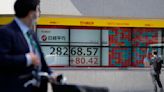Asian shares mixed as surging oil prices fan inflation fears