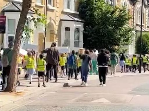 Hackney primary school students chant in streets urging people to vote