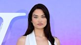 Shanina Shaik stuns in a plunging waistcoat style gown at V&A party