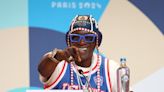 Why is Flavor Flav at the 2024 Paris Olympics?