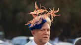 Mike Tindall tries on wife Zara’s hat at the races Down Under