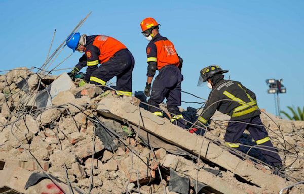 Hopes are fading for 44 workers still missing days after South Africa building collapse; 9 are dead