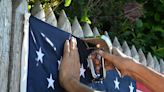 ‘All people’s flag’ returns to Northbrook fence thanks to Northbrook military veterans