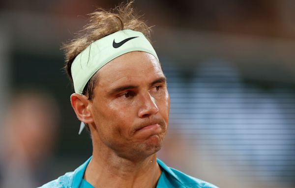 French Open day two: Rafael Nadal makes early exit but Iga Swiatek progresses