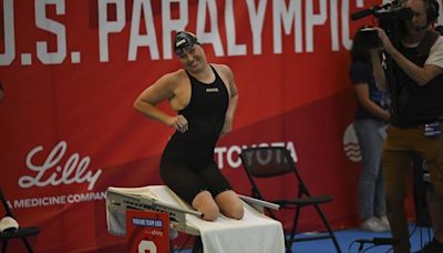 While Simone Biles competes across town, Paralympic star Jessica Long rolls at swimming trials