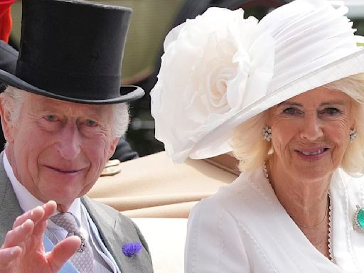 Here come the royals! King and Queen arrive side by side at Ascot