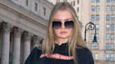 Anna Delvey Wears Oversize Shades and Cheeky ‘I H8 Anna Delvey’ Shirt for ICE Visit