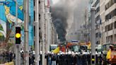 With blaring horns rumbling engines, farmers in tractors block Brussels to protest EU policies