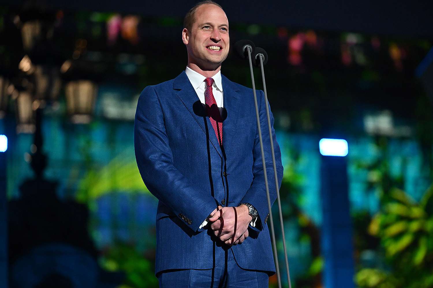 Prince William Lets Out a Candid Laugh on Stage Thanks to a Singing Fan in Viral Clip