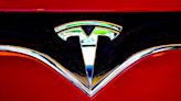 Tesla stock slumps again after troubled EV maker cuts prices ahead of earnings report