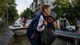 Rescuers are braving snipers as they rush to ferry Ukrainians from Russia-occupied flood zones