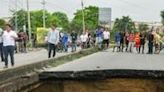 A section of a bridge connecting the city of Barranquilla to the airport in Soledad failed in heavy rains