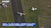 Small plane loses power and skims suburban rooftops before making crash landing on belly | VIDEO