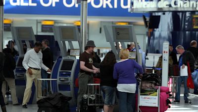 Heathrow baggage chaos as British Airways passengers left without belongings and stranded for hours due to IT failure