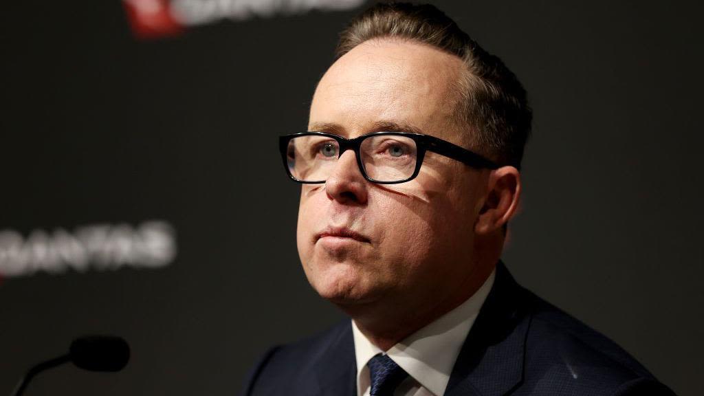 Former Qantas boss has exit pay slashed by millions