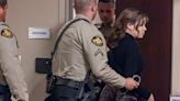 Hannah Gutierrez-Reed looks over at her mom Stacy Reed as she is taken into custody after the guilty verdict during her trial at First District Court in Santa Fe