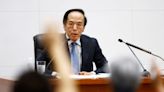 BOJ lifts rates, signals slow end to historic bond buying binge