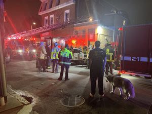 Seven people hurt after porch collapses at a building in Roxbury