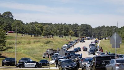 Two students, two teachers killed in Georgia high school shooting; 14-year-old suspect is in custody