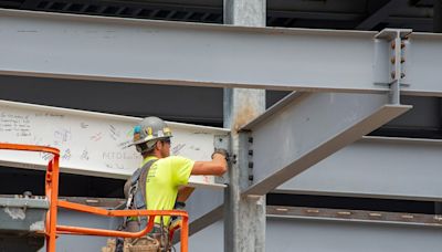 Hagerstown marks halfway point in field house construction with 'topping-off' ceremony.