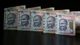 Rupee nudges higher tracking Asian peers; India budget awaited