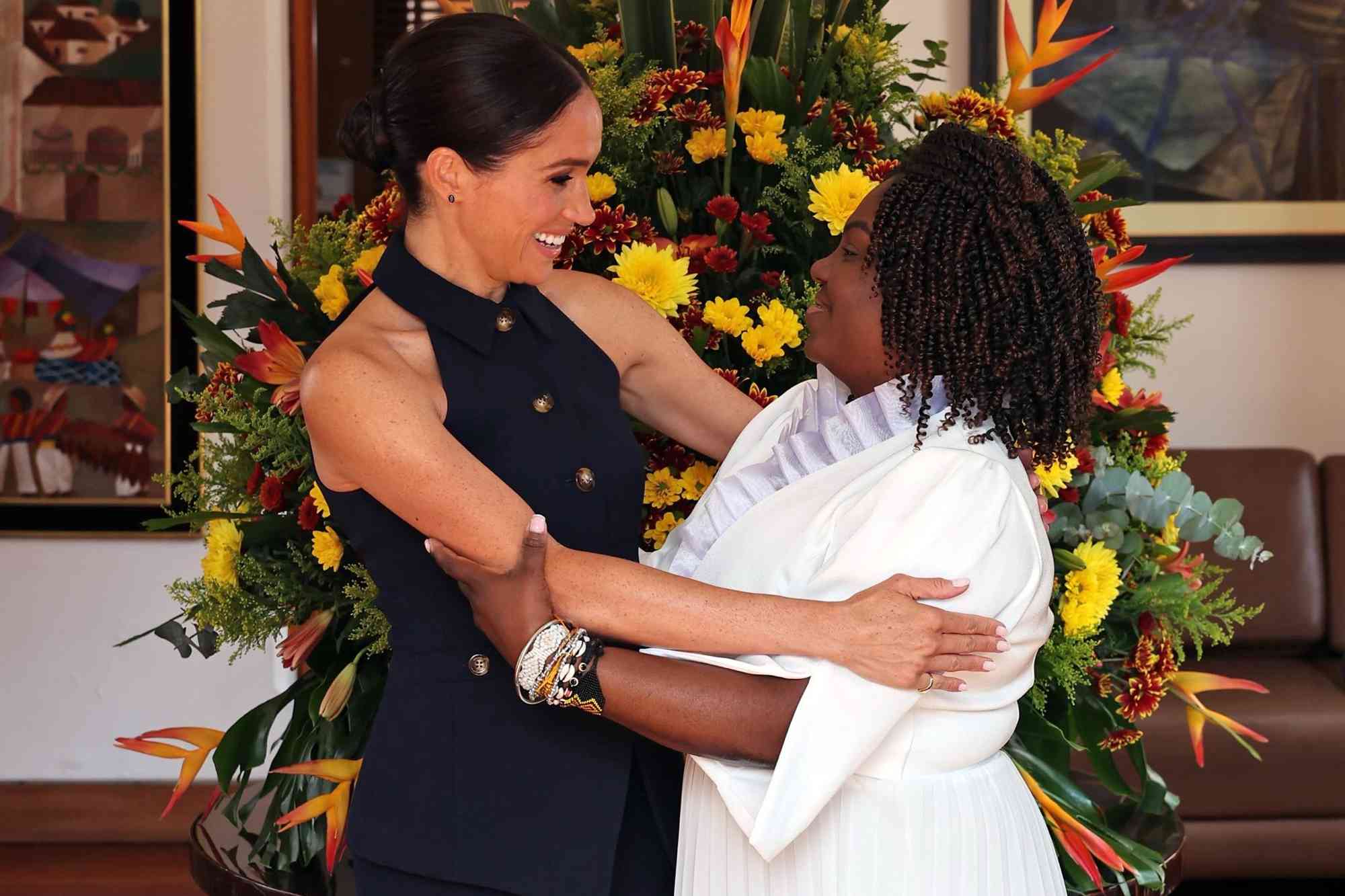 Meghan Markle and Prince Harry Touch Down in Colombia and Break Traditional Cheese Bread with Vice President