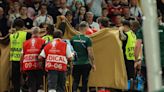 Hungary's Varga stable after going off on stretcher