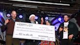 West family spreads cheer with $4,200 check to Empty Stocking Fund at battle of the bands