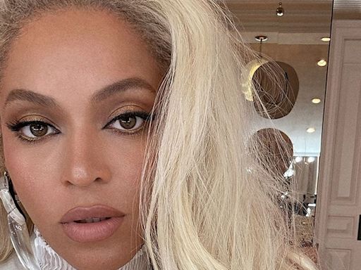 Beyoncé is a vision in white tux as she make surprise visit to Hamptons record store