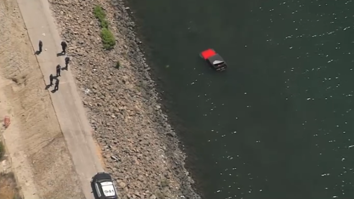 Man rescued after car becomes submerged in Long Beach waterway