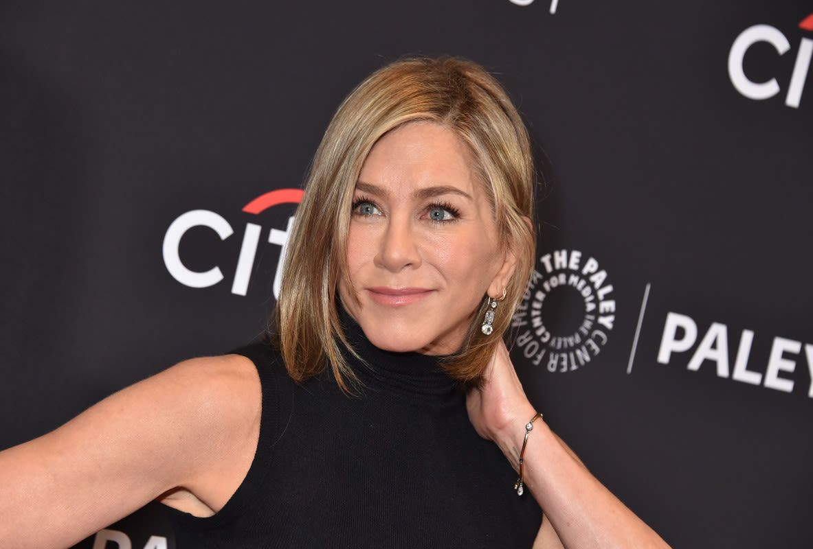 Jennifer Aniston Snuggles With Her Dog in Rare Photo Dump That Has Fans Calling for More