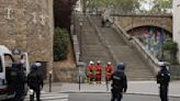 Police in Paris detain a man wearing fake explosives vest at Iran's Consulate