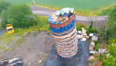 ‘Police’ car placed on top of bonfire