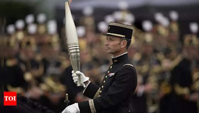 France's Bastille Day parade meets the Olympic torch relay in an exceptional year - Times of India