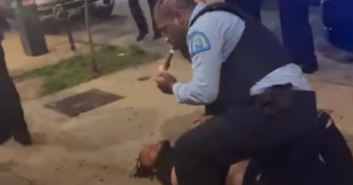 Cigar-smoking cop straddles suspect outside St. Louis bar