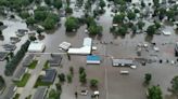 Helicopters scramble to rescue people in flooded Iowa town while much of US toils again in heat